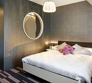Bett in der Lifestyle Familien Suite im Hotel Continental Luzern